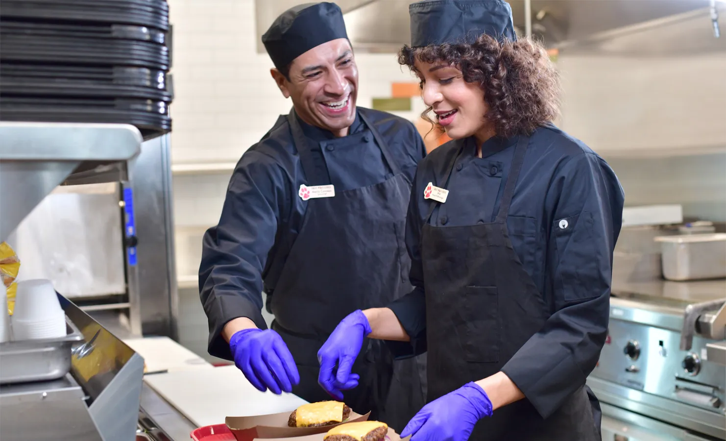 Chef and cook in kitchen
