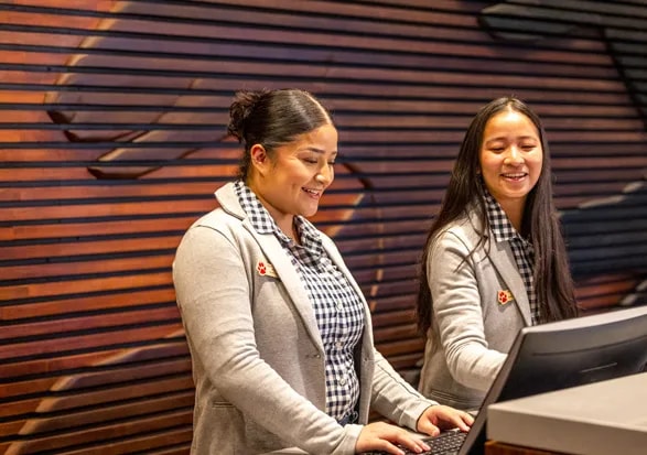 Pack Members working at the front desk