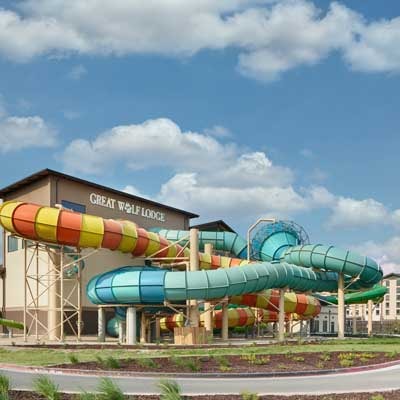 Photo of the outside of Great Wolf Lodge where the slides are coming out of the building.